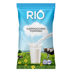 Rio Cappuccino Topping Powder Instant Vending Sachet 10 x 500g. A picture of a single blue and white bag of Rio Cappuccino Topping powder depicting milk pouring into a glass and a cow in a field with buttercups on a white background - Discount Coffee