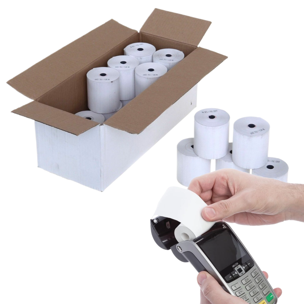 White thermal receipt paper rolls shown in an open cardboard box, with several loose rolls beside a hand holding one roll over a handheld payment terminal. A pair of hands is visible, so this is classified as Lifestyle.