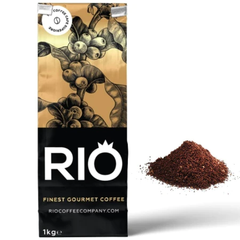 Rio Decaf Ground Coffee 1 kg. A pack of Rio decaffeinated ground coffee with a1 kg weight indication, featuring a graphic of coffee beans. A small pile of ground coffee is also visible in the foreground - Discount Coffee