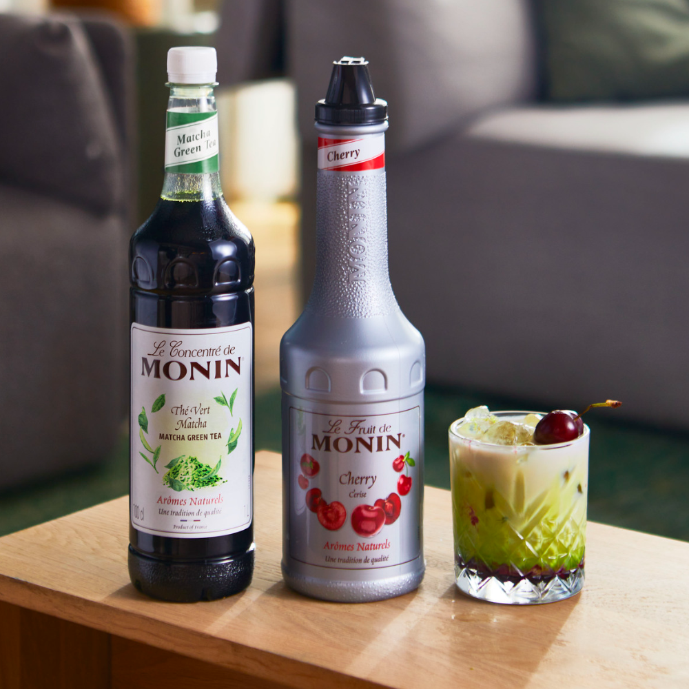 Monin Premium Matcha Concentrate (1 Litre) With a Bottle of Monin Cherry Puree With a Glass of Iced Cherry Matcha - Discount Coffee