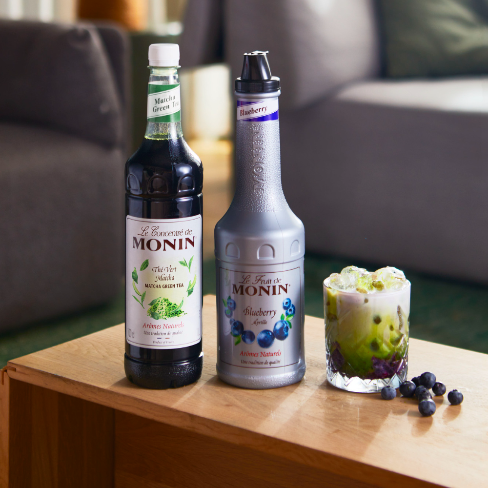 Monin Premium Matcha Concentrate (1 Litre) With a Bottle of Blueberry Puree and a Glass of Iced Blueberry Matcha - Discount Coffee