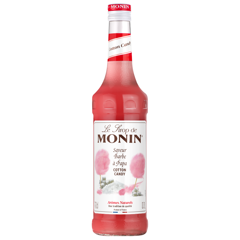 A 700ml bottle of Monin Cotton Candy syrup, featuring a vibrant pink liquid and a white label with pink cotton candy illustrations, set against a plain white background.
