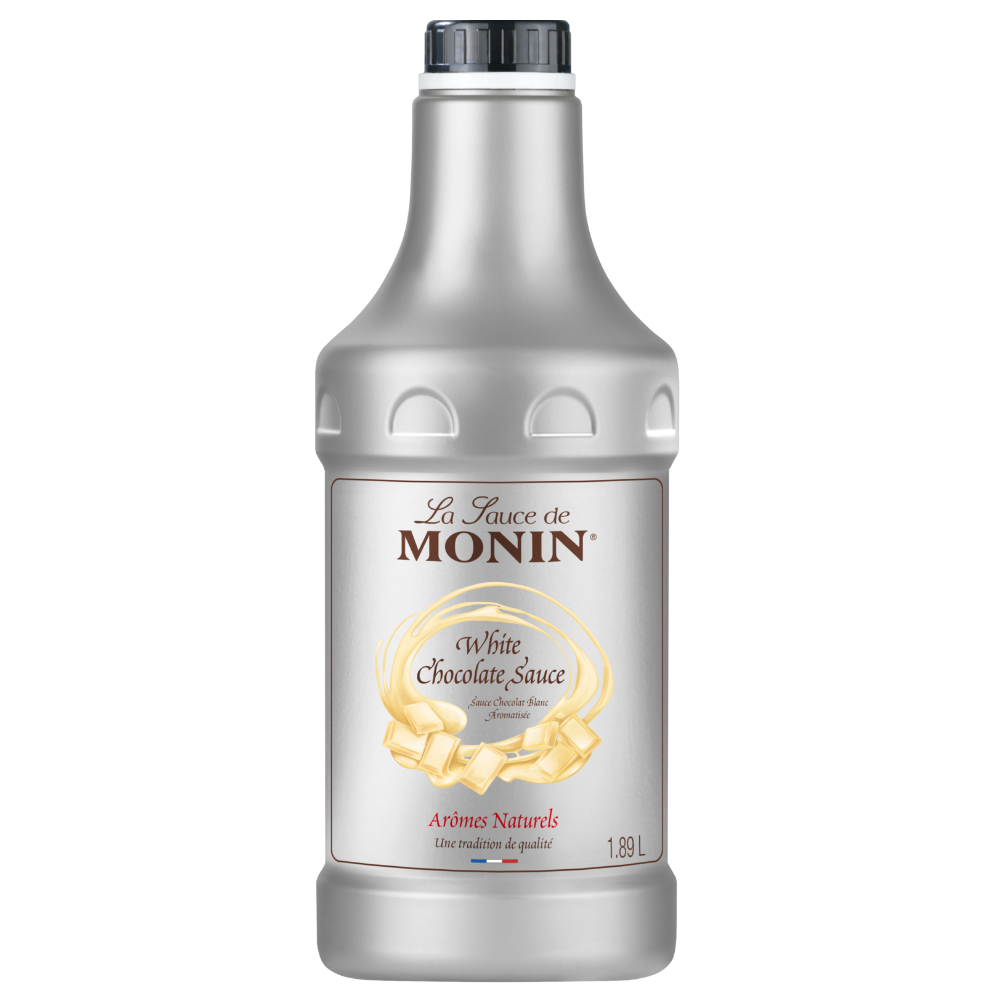 A 1.89 L plastic bottle of Monin White Chocolate Sauce with a black cap and a white label featuring gold and brown text - Discount Coffee