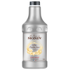A 1.89 L plastic bottle of Monin White Chocolate Sauce with a black cap and a white label featuring gold and brown text - Discount Coffee