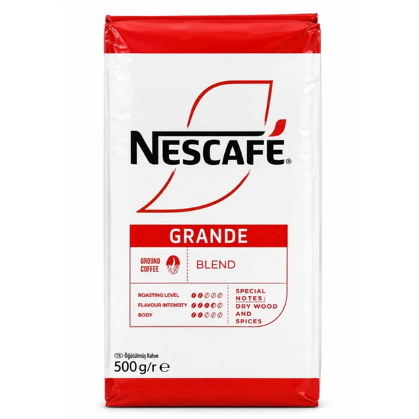 A 500g bag of Nescafe Grande Blend ground coffee, featuring a white bag with red borders and the black and red Nescafe logo.