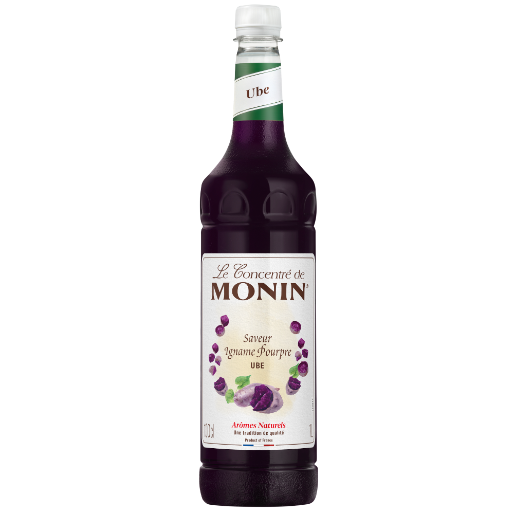 A bottle of Monin Ube Syrup 1 litre, featuring a white label with purple grape illustrations and a dark purple liquid inside, set against a plain white background.
